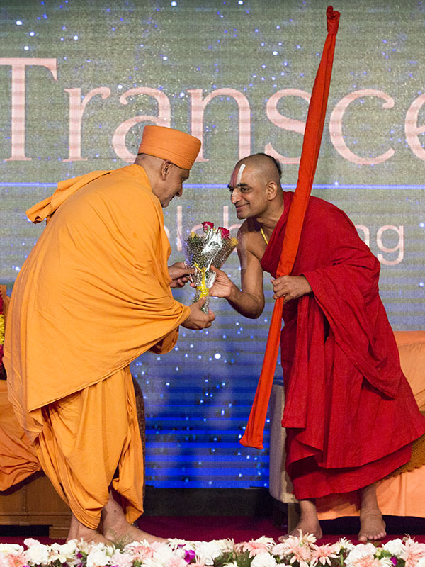 H.H. Sri Chinna Jeeyar Swamiji is welcomed with a bouquet of flowers