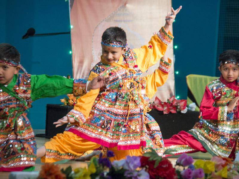 children perform a cultural dance 