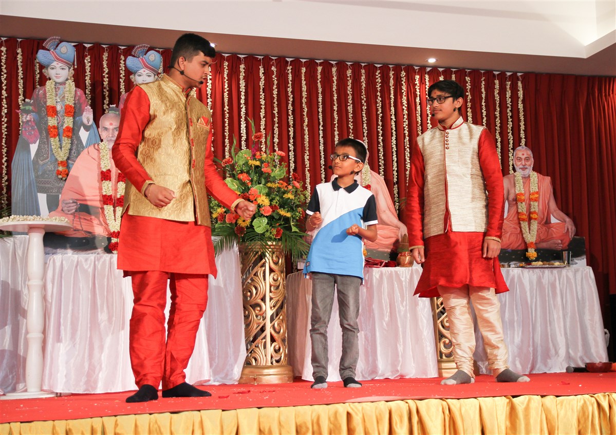 Children present an enlightening skit explaining the holistic benefits of the new mandir for the local community