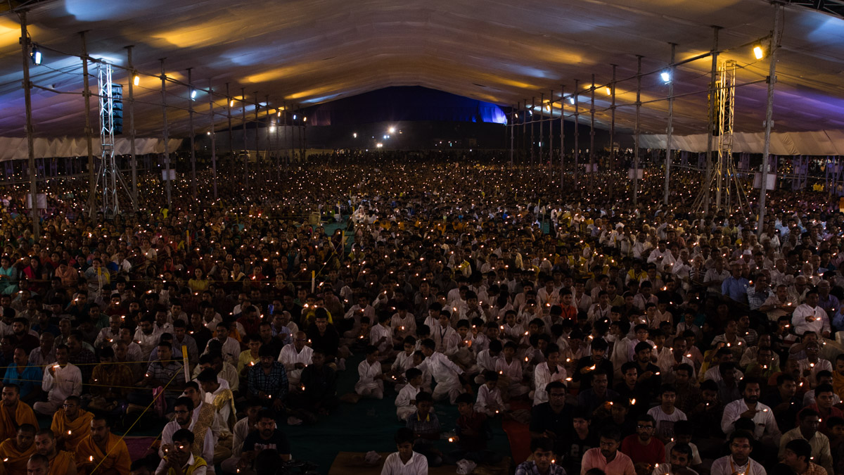 Devotees perform the arti