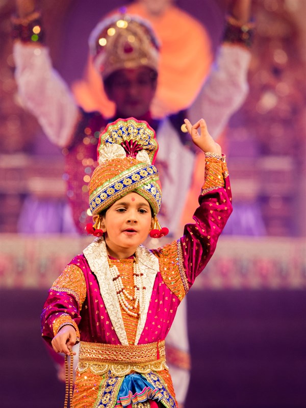 Children and youths perform a traditional dance