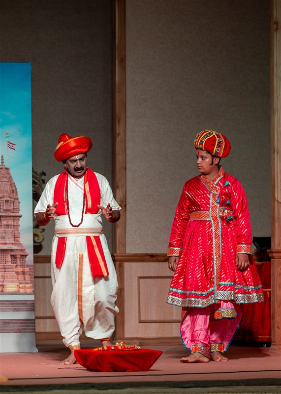 Youths and devotees perform a cultural program