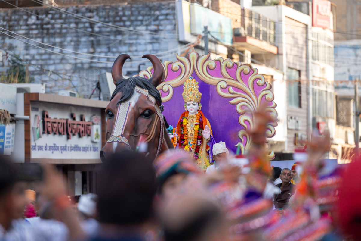 Shri Ghanshyam Maharaj on a decorative rath (chariot)