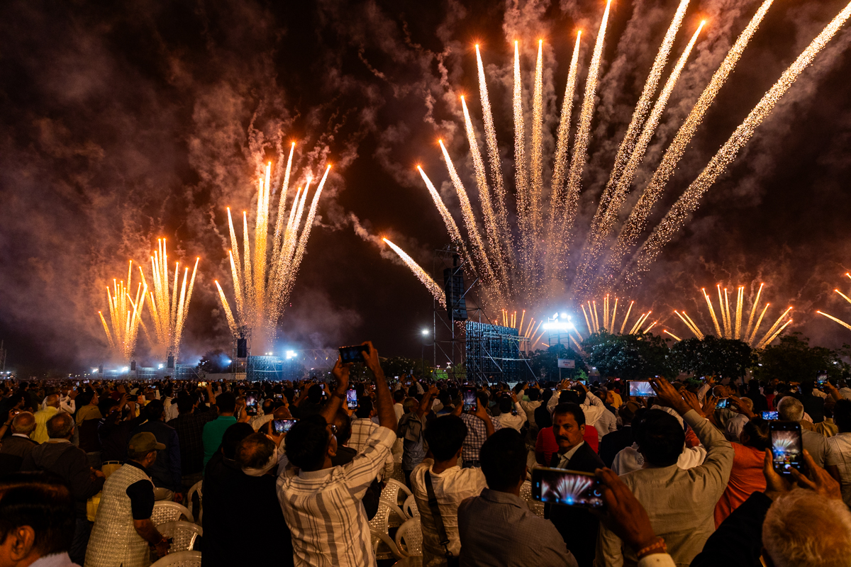 Devotees watch the fireworks