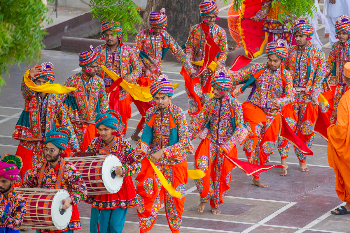 Youths perform a traditional dance in the Rathyatra procession